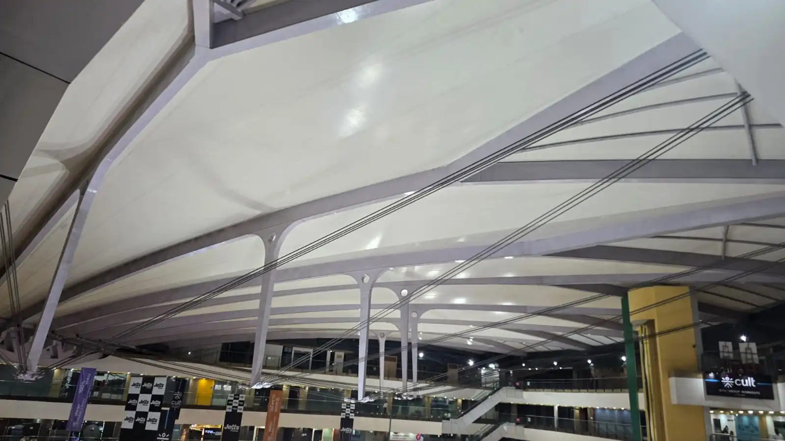 Vasant Square Mall Vasant Kunj — a mast head and clevis fitting anchoring the cable stays that shape the membrane, Ekra Decor
